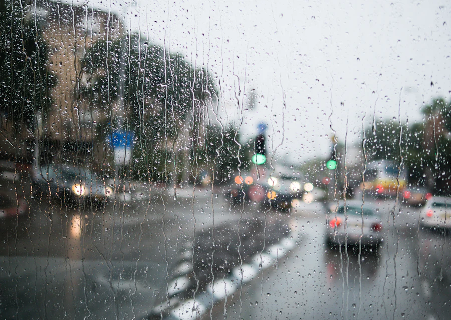 Rain falling on a wet street under a grey sky